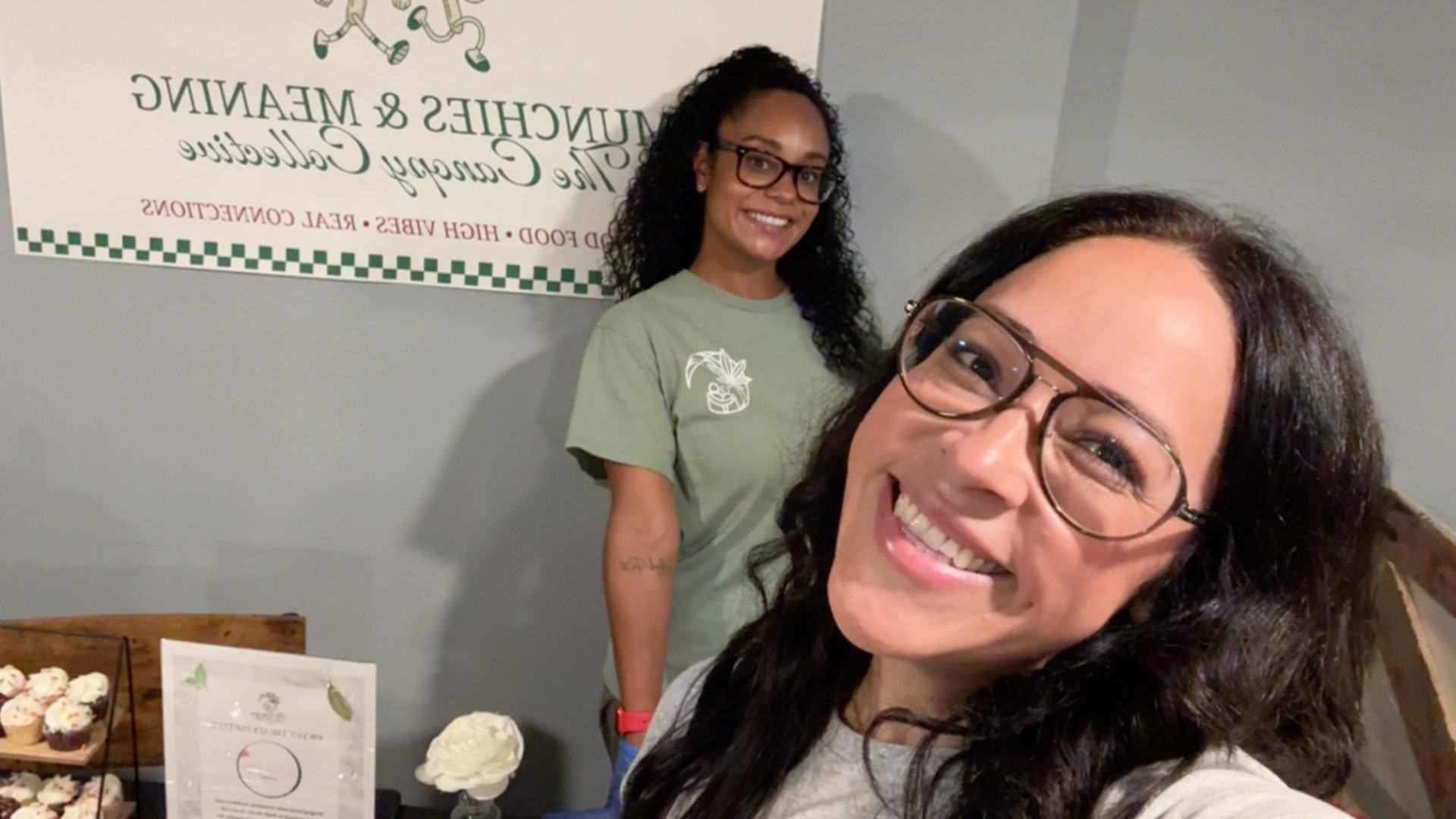 Two community members smiling together in a close-up photo.